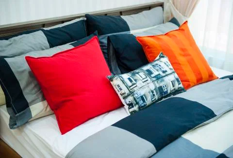 Bed with pillows Stock Photos