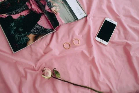 A bed with a pink blanket Stock Photos
