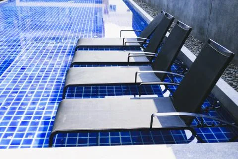 Bed in the pool. Stock Photos