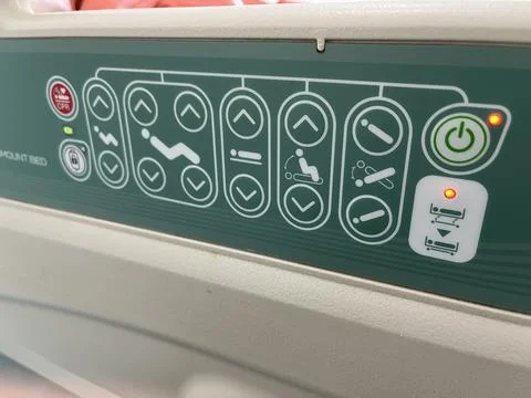 Bed remote control for adjusting the bed position. Stock Photos