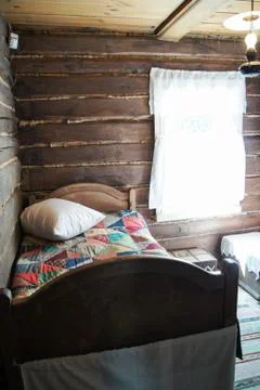 Bed in a Russian hut. Stock Photos