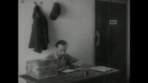 Bed sheet being distributed to POW soldier - 1945 Vídeo Stock 91586024