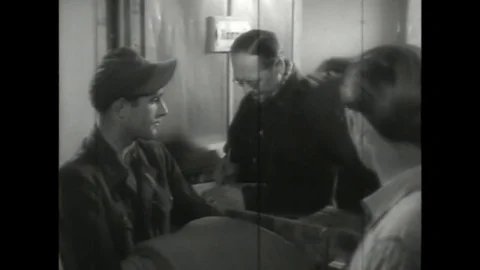 Bed sheet being distributed to POW soldier - 1945 Vídeo Stock 91586048