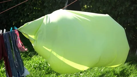 Bed Sheet drying in the wind Stock Footage 78490624