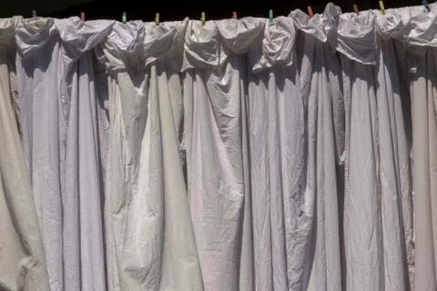 Bed sheets drying outdoor. Abstract pattern Stock Photos