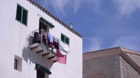 Bed sheets on Spanish balcony Stock Footage 98435267