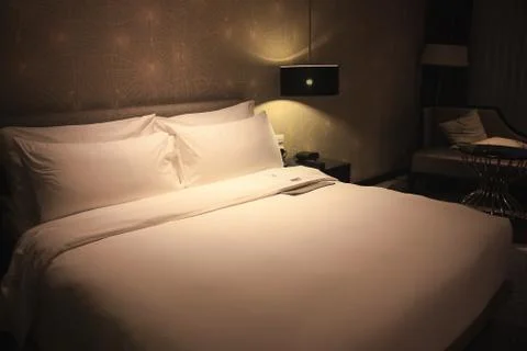 Bed with soft light Stock Photos