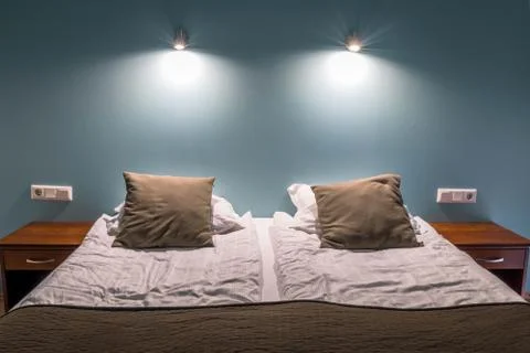Bed with two brown pillows Stock Photos