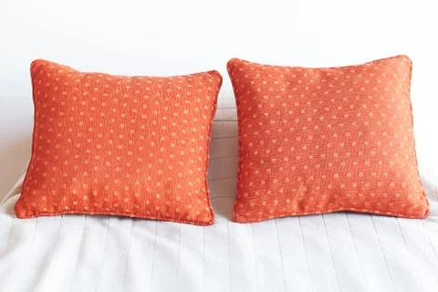 Bed with two pillows and white blanket Stock Photos