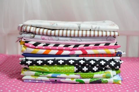 Bedding folded on the bed Stock Photos