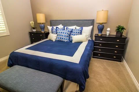 Bedroom With Bed, Two Nightstands &amp; Two Lamps Stock Photos