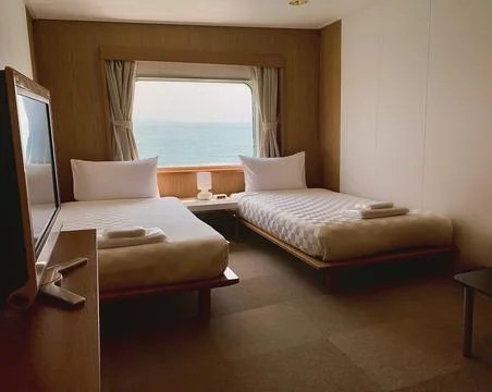 Bedroom with interior of double passenger cabin ferry ship with ocean view. Stock Illustration