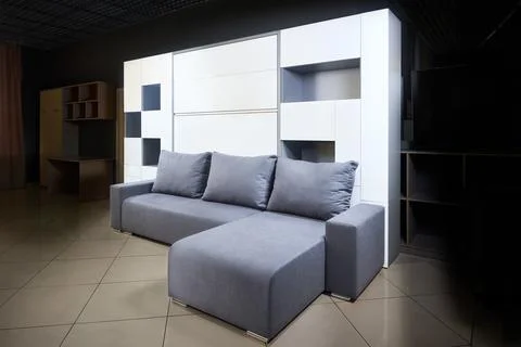 Bedroom interior flat with folded Vertical Murphy Wall Bed roll-away pull out Foto stock
