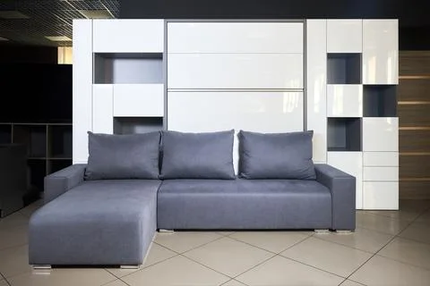 Bedroom interior flat with folded Vertical Murphy Wall Bed, roll-away pull ou Stock Photos