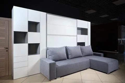 Bedroom interior flat with folded Vertical Murphy Wall Bed, roll-away pull .. Stock Photos