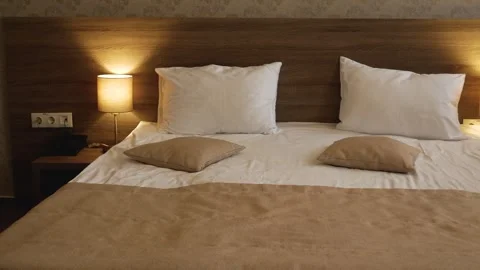 Bedroom interior. Large bed with two pillows. Stock Footage 321255012