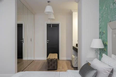 Bedroom interior with mirror wardrobe Stock Photos