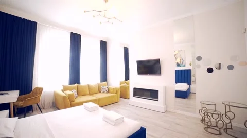 Bedroom interior, modern style, large bed, light colors, white, pink, beige Stock Footage 152509706