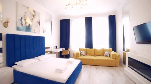 Bedroom interior, modern style, large bed, light colors, white, pink, beige Stock Footage 152509718