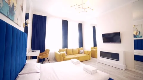 Bedroom interior, modern style, large bed, light colors, white, pink, beige Stock Footage 152509722