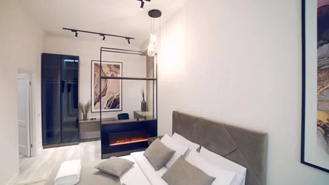 Bedroom interior, modern style, large bed, light colors, white, pink, beige Stock Footage 152510108