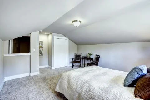 Bedroom interior with vaulted ceiling and sitting area Stock Photos