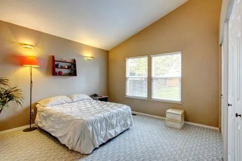 Bedroom interior with vaulted ceiling Stock Photos