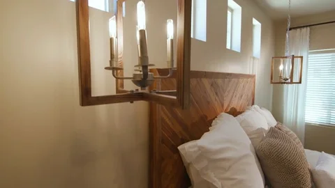 Bedroom Lowering Close Up Light to Nightstand and Bed Corner Stock Footage 76269411