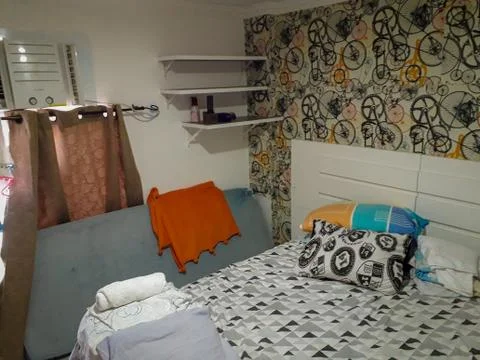Bedroom with pillow, side table on Flat Resort. Stock Photos