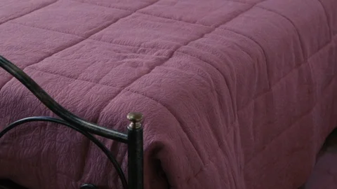 Bedroom with pink sheets Stock Footage 87747091