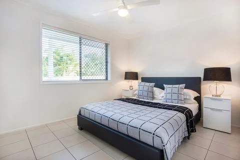 Bedroom Setting with Side Tables 스톡 사진