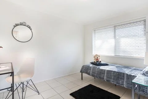 Bedroom Setting with Single Bed Stock Photos