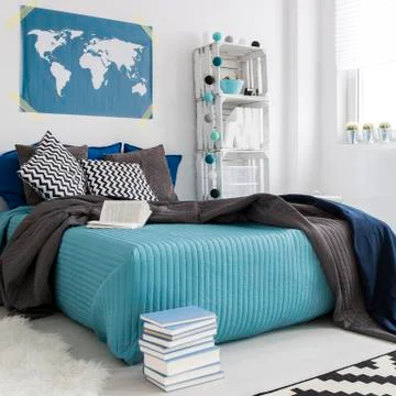 Bedroom with world map on the wall Stock Photos