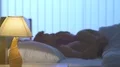 The bedside lamp on the background of a couple in the bed. night time 4k or 4k+ Resolution