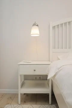 Bedside table in the bedroom interior Stock Photos