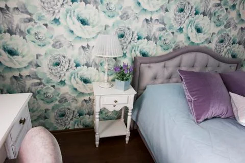 Bedside table, llamp, pot with flower, interior in Provence style Stock Photos