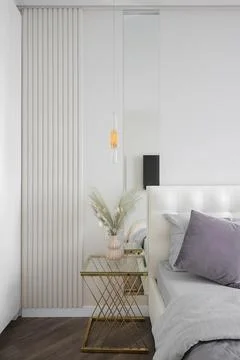 Bedside table near the bed in the bedroom Stock Photos