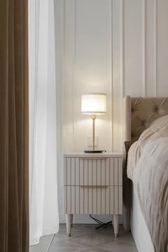 Bedside table with table lamp Foto stock