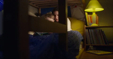 Bedtime reading mum and son travelshot Stock-Footage 45665368