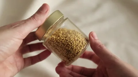 Bee pollen granules in a jar in granules. Healthy superfood. Stock Footage 317721569