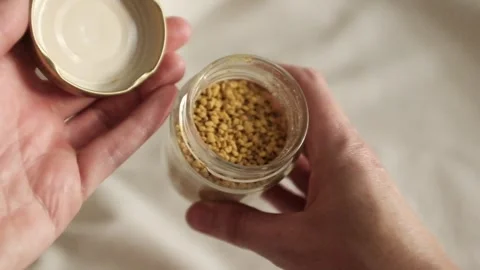 Bee pollen granules in a jar in granules. Healthy superfood. Stock Footage 317721574
