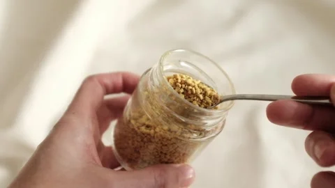 Bee pollen granules in a jar in granules. Healthy superfood. Stock Footage 317721582