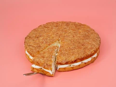 Bee sting cake, light cake with cream filling, with crispy almonds. Stock Photos