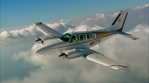 Beechcraft Baron Air to AirBacklight Stock Footage 68577273