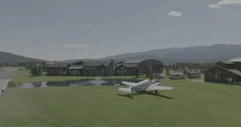 Beechcraft Plane Twin Engine Taxiing on Grass Yard Estate Stock Footage 220989646