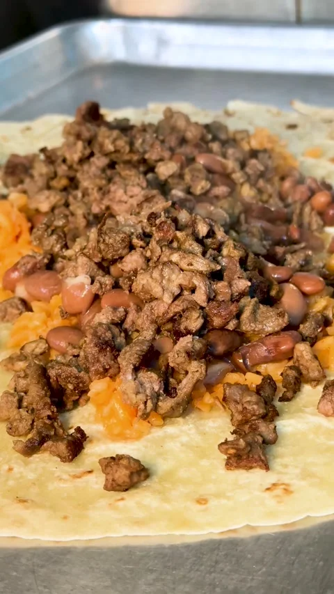 Beef and Beans on Open Tortilla Stock Footage 318749290