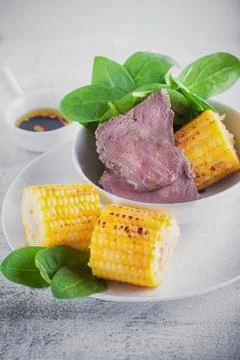 Beef and grilled corn Stock Photos
