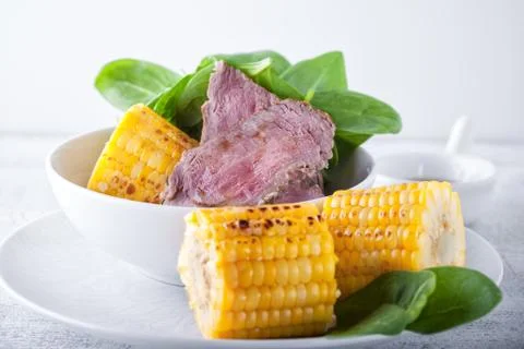 Beef and grilled corn Stock Photos