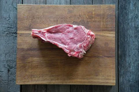 Beef back on a cutting board. Stock Photos