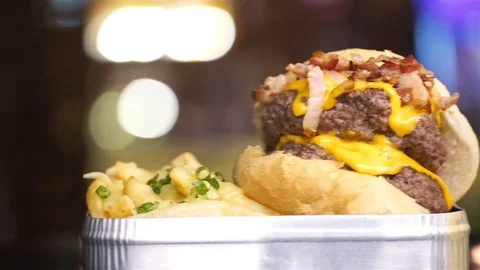 Beef Bacon Cheese Burger With French Fries And Beer - Close Up - Pan - Left T Stock Footage 79083639